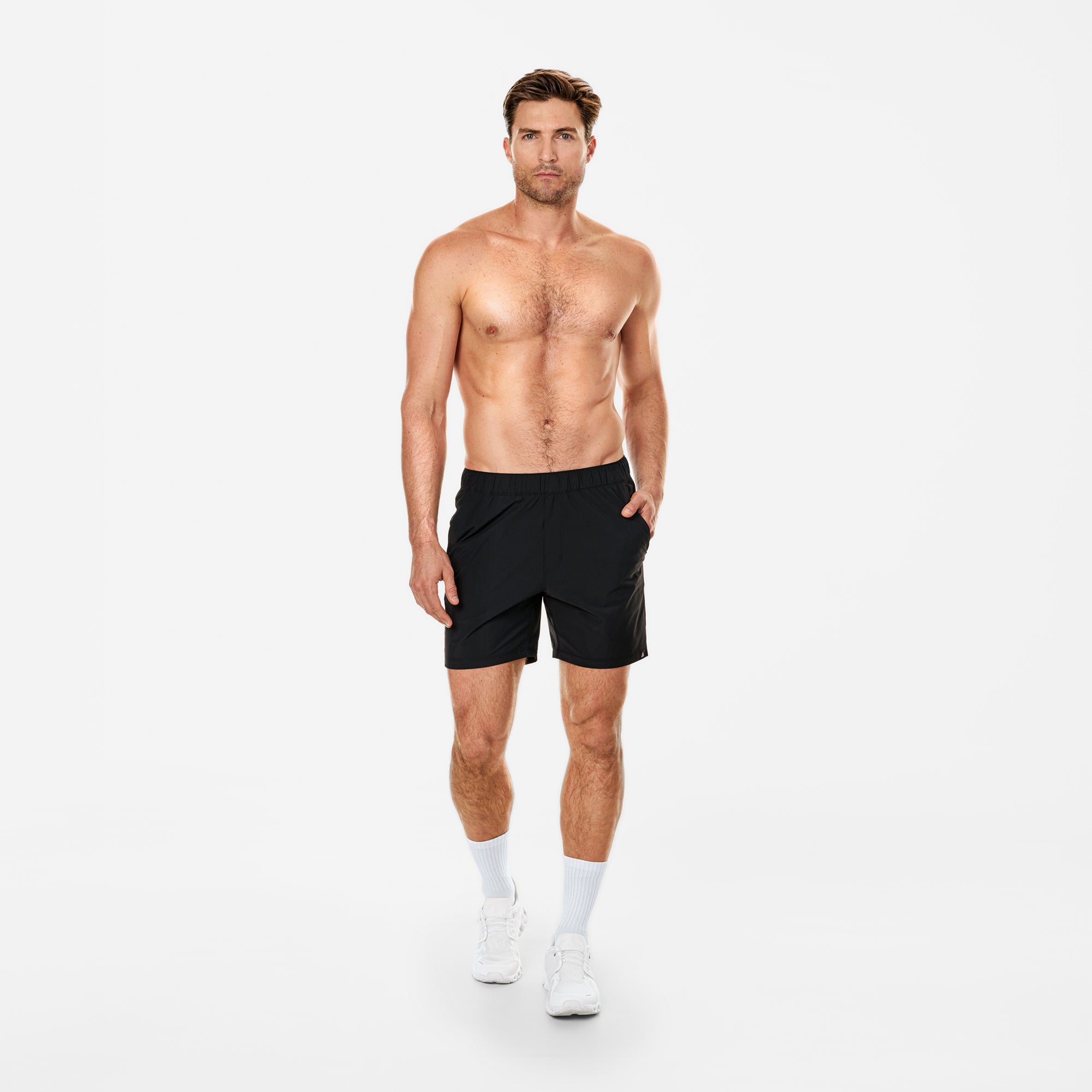 Man wearing black shorts on a white background