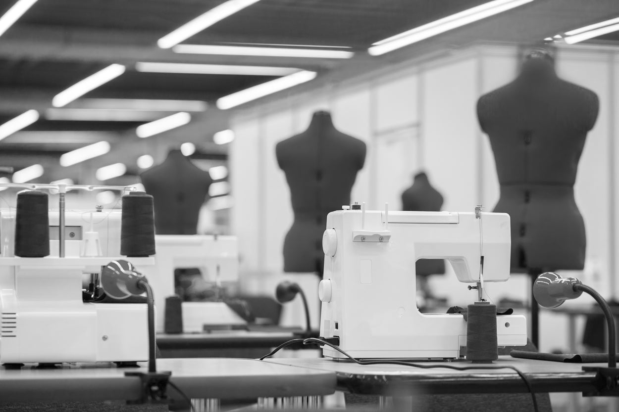 A clothing factory showing sewing machines and sewing dummies